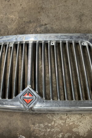 Front Grille INTERNATIONAL OEM 4047377C1. Paint Peeled in Corner