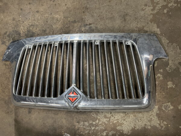 Front Grille INTERNATIONAL OEM 4047377C1. Paint Peeled in Corner